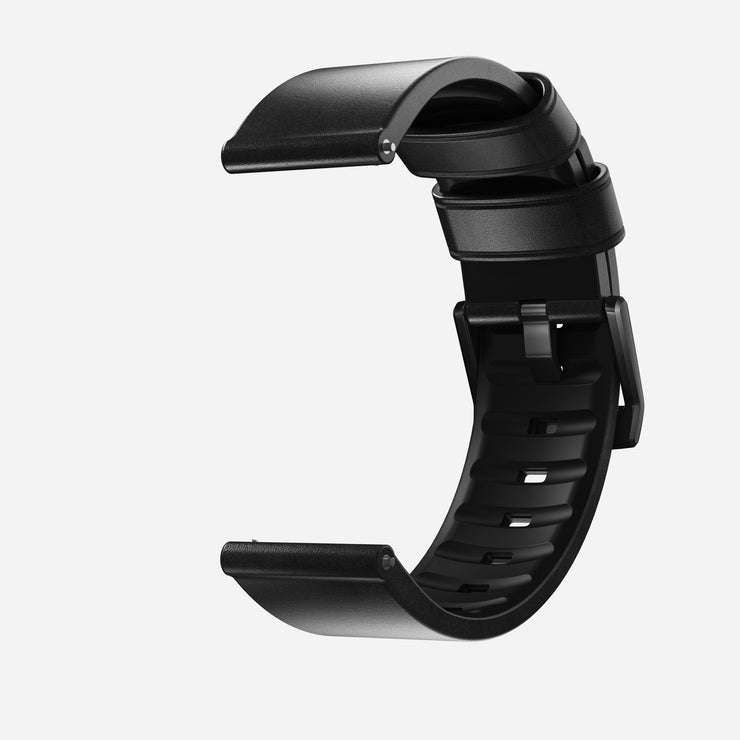 The Nomad Active Band Pro - 22mm Quick Release in Black Horween leather with black hardware features a stainless steel buckle and is shown open, angled left, against a plain white background.