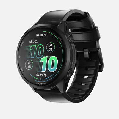 A Nomad Active Band Pro - 22mm Quick Release in Black Horween leather with black hardware is shown on a smartwatch with a round face, displaying time, date, battery, steps, heart rate, and activity icon against a plain white background.