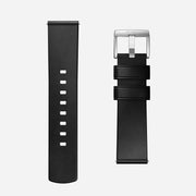 Two Nomad Active Band Pro - 22mm Quick Release straps in Black Horween leather with silver hardware are shown on a white background: the left displays sizing holes, while the right shows a stainless steel buckle and two securing loops.