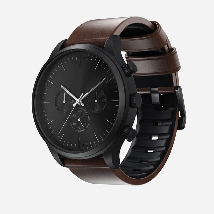The Nomad Active Band Pro, a brown Horween leather strap with black hardware and 22mm quick release, is displayed against a white background.