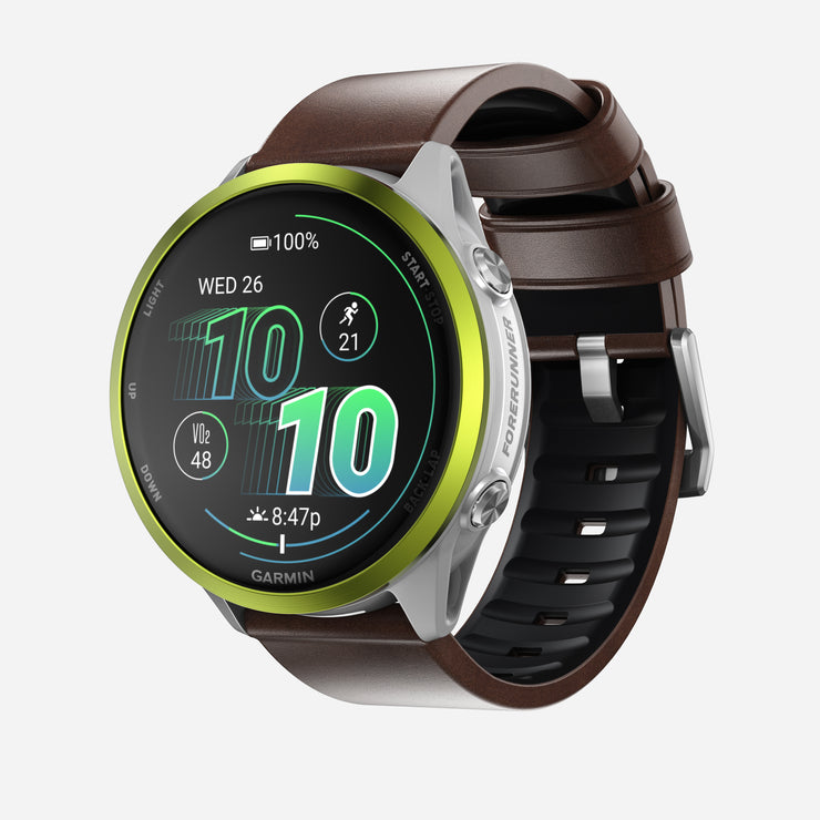 The Nomad Active Band Pro features a 22mm quick release brown Horween leather strap with silver hardware, pairing stylishly with Garmin smartwatches that display time, date, steps, battery level, heart rate, and activity icons.