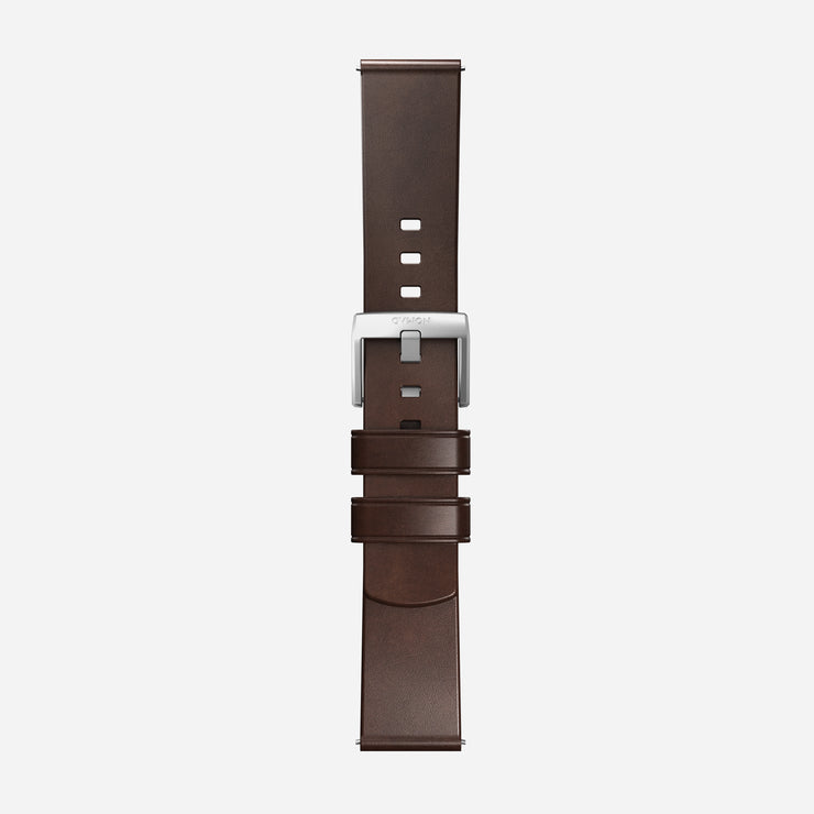 The Nomad Active Band Pro - 22mm Quick Release in Brown Horween leather with silver hardware is shown laid flat on a white background, featuring multiple adjustment holes and two loops near the stainless steel buckle.