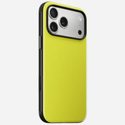 The Nomad Modern Case - iPhone 17 Pro Max | Volt stands upright against a white background, showing its yellow back, triple camera lenses with flash, and a sturdy TPU bumper offering 8ft drop protection.