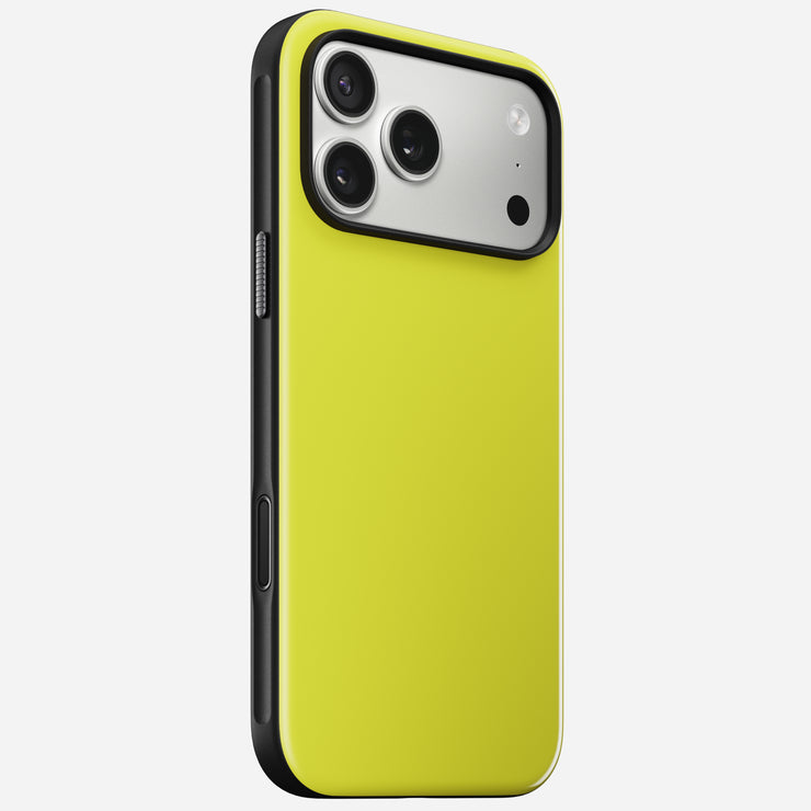The Nomad Modern Case - iPhone 17 Pro Max | Volt stands upright against a white background, showing its yellow back, triple camera lenses with flash, and a sturdy TPU bumper offering 8ft drop protection.