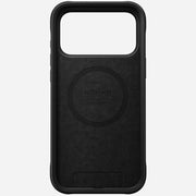 The Nomad Rugged Leather Case for iPhone 17 Pro Max in black is crafted from Horween leather, featuring a large rectangular camera cutout and a circular MagSafe alignment ring inside.