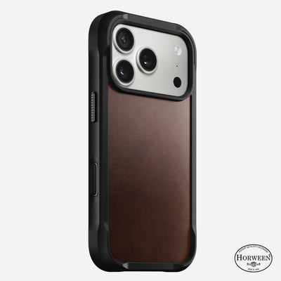 The Nomad Rugged Leather Case for iPhone 17 Pro features a black protective frame, a rustic brown Horween leather back with the Horween logo at the bottom right, supports three camera lenses, and provides 15ft drop protection.