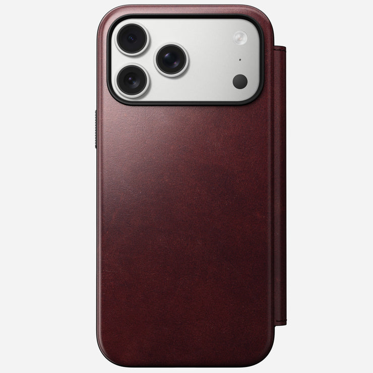 The Nomad Modern Leather Folio for iPhone 17 Pro Max in Burgundy Horween leather is shown from the back, displaying a smartphone with a triple camera setup against a plain white background.