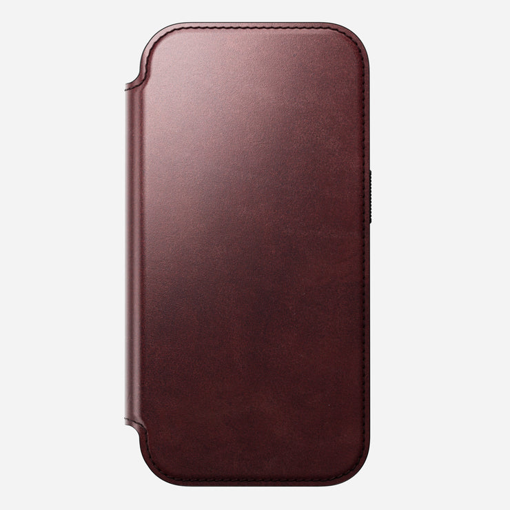 A closed, burgundy Horween leather Modern Leather Folio by Nomad for iPhone 17 Pro, shown from the front with rounded edges against a white background.