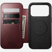 The Nomad Modern Leather Folio for iPhone 17 Pro in Burgundy is made from Horween leather, features three card slots, a MagSafe-compatible black case with MagSafe ring, and has the Nomad logo embossed on the premium leather.