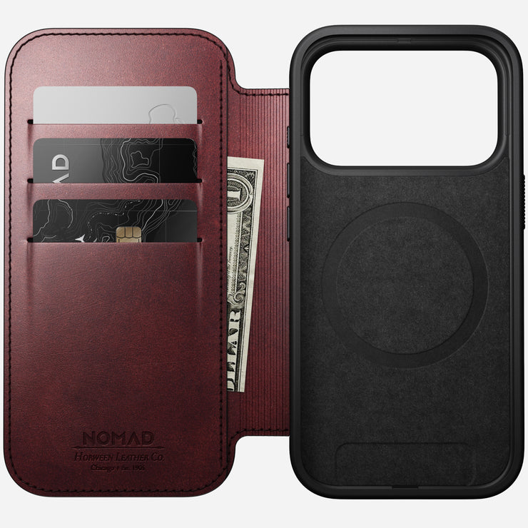 The Nomad Modern Leather Folio for iPhone 17 Pro in Burgundy is made from Horween leather, features three card slots, a MagSafe-compatible black case with MagSafe ring, and has the Nomad logo embossed on the premium leather.