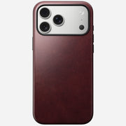 The Nomad Modern Leather Case in Burgundy, made from Horween leather, encases the iPhone 17 Pro Max with three rear camera lenses and offers a smooth texture plus MagSafe compatibility.