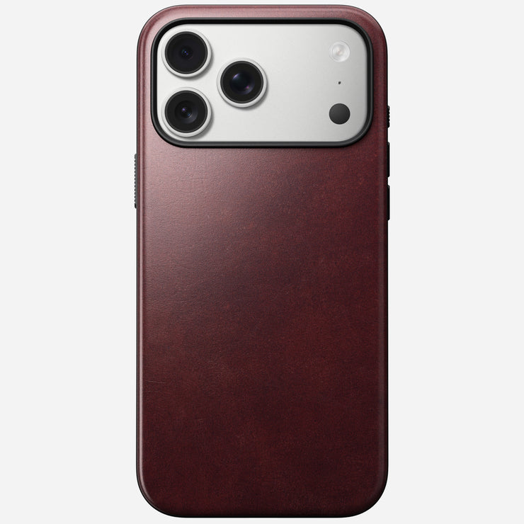 The Nomad Modern Leather Case in Burgundy, made from Horween leather, encases the iPhone 17 Pro Max with three rear camera lenses and offers a smooth texture plus MagSafe compatibility.