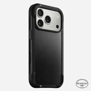 The Nomad Rugged Leather Case for iPhone 17 Pro in black is shown on a white background, displaying its Horween logo, dual camera cutout, and MagSafe compatibility for easy accessory use.
