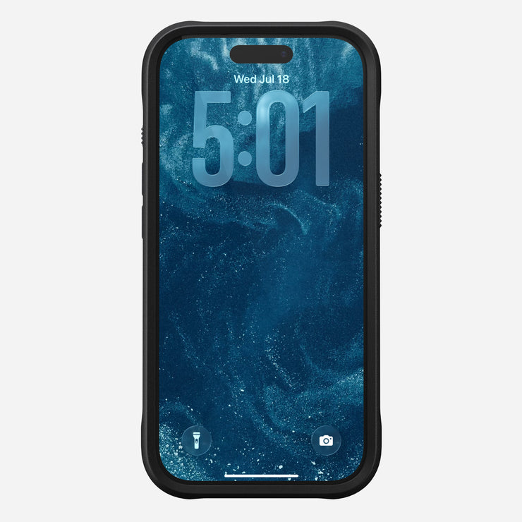 A Nomad Rugged Leather Case in black (Horween) protects an iPhone 17 Pro displaying a blue wave lock screen, showing the time 5:01 and date Wed, Jul 18, with flashlight and camera icons at the bottom. MagSafe compatible.