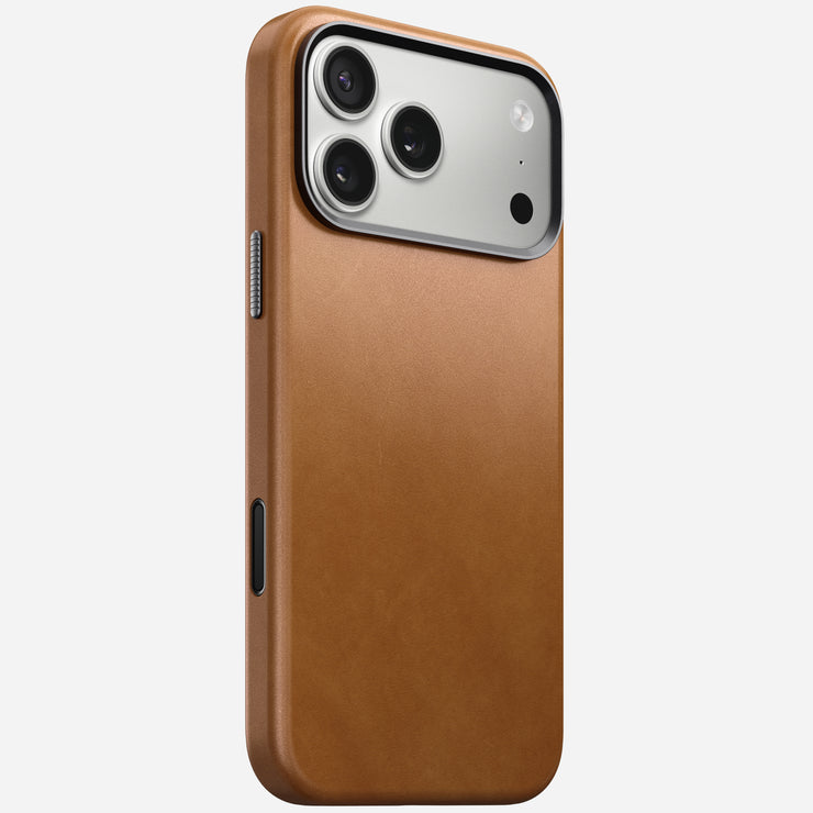 The Nomad Traditional Leather Case in English Tan for iPhone 17 Pro Max, featuring three rear camera lenses and a flash, is shown from an angled rear view against a plain white background.