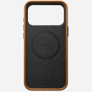 The Nomad Traditional Leather Case for iPhone 17 Pro Max in English Tan features sustainable brown and black leather, a rectangular top camera cutout, and a circular MagSafe area, shown on a white background.