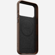 The Nomad Traditional Leather Case for iPhone 17 Pro Max in brown is crafted from full-grain leather with MagSafe, shown upright to display its interior, side buttons, camera control button, and precise camera cutout.