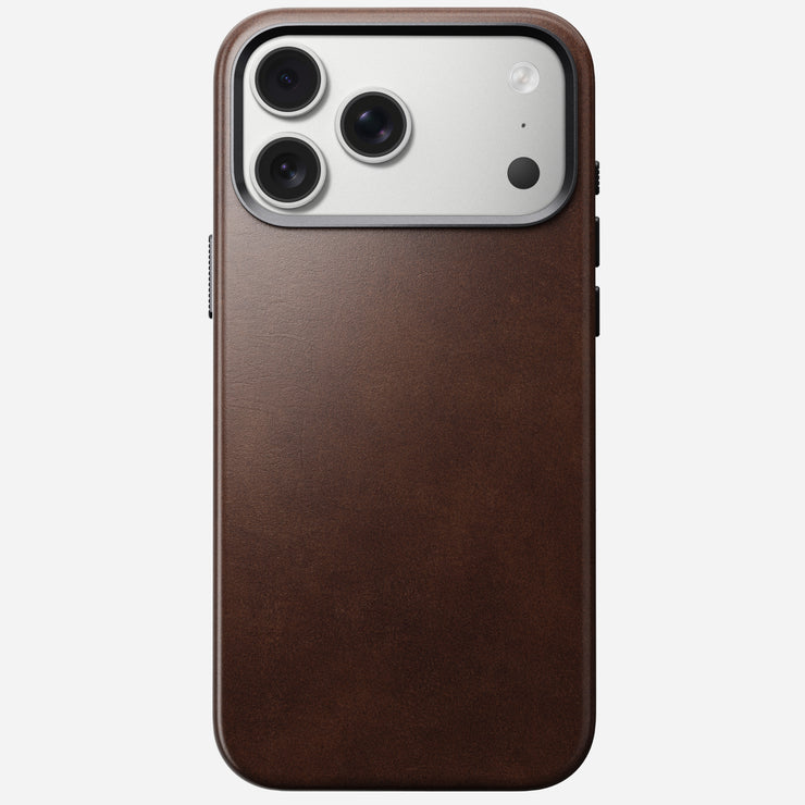 The Nomad Traditional Leather Case for iPhone 17 Pro Max in Rustic Brown Horween leather is shown MagSafe-compatible, on a white background with the phone’s triple camera and flash visible.