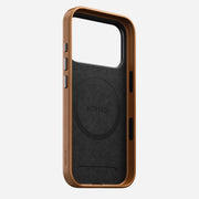 The Nomad Traditional Leather Case for iPhone 17 Pro in English Tan combines brown and black full-grain leather, rounded edges, side button covers, a circular MagSafe logo inside, and Nomad branding on the interior and side.