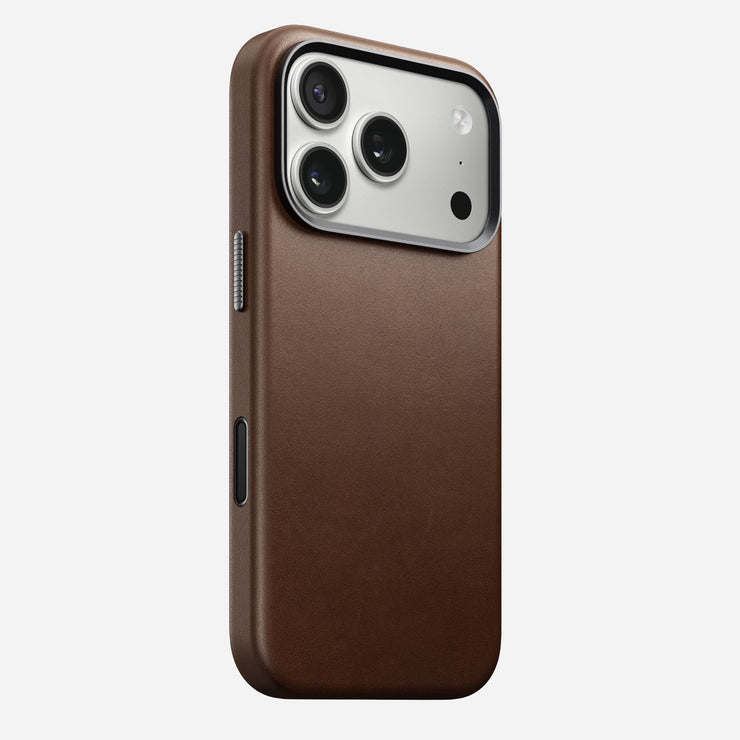 The Nomad Traditional Leather Case for iPhone 17 Pro in brown, featuring MagSafe compatibility, large camera lenses, and side buttons, is shown against a plain white background.