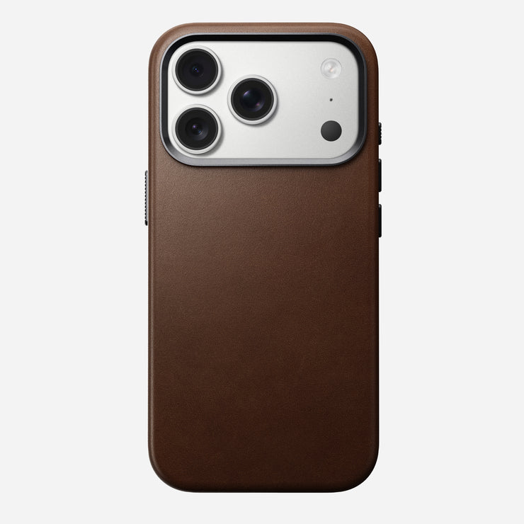 The Nomad Traditional Leather Case for iPhone 17 Pro in brown, shown on a phone with a triple-lens camera and flash, appears against a plain white background.