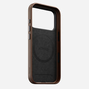 The Nomad Traditional Leather Case for iPhone 17 Pro in brown stands upright, displaying its sustainable leather, MagSafe compatibility, and precise cutouts for buttons and camera.