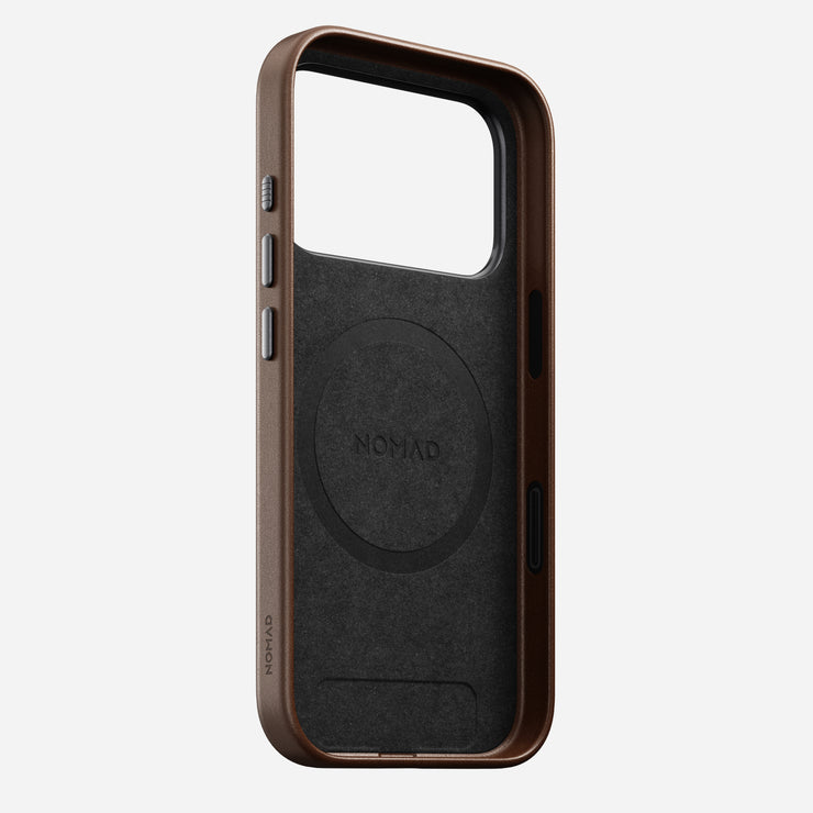 The Nomad Traditional Leather Case for iPhone 17 Pro in brown stands upright, displaying its sustainable leather, MagSafe compatibility, and precise cutouts for buttons and camera.