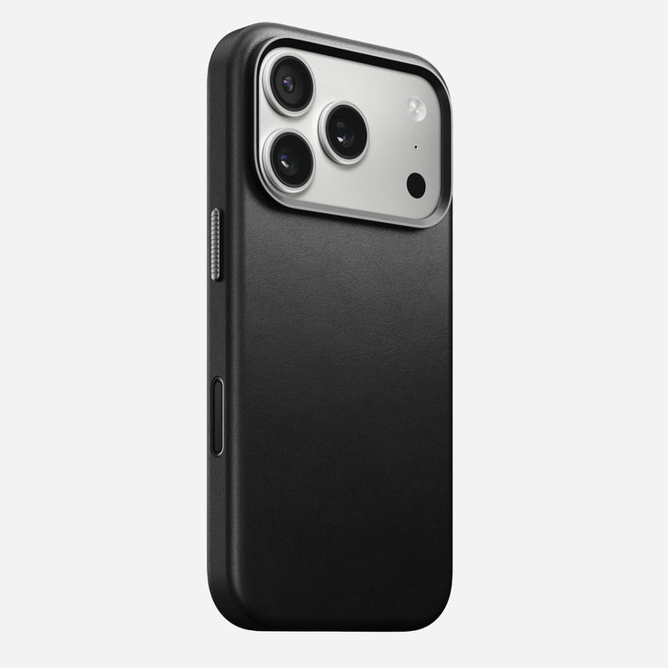 The Nomad Traditional Leather Case for iPhone 17 Pro in black features sustainably sourced full-grain leather with a smooth finish, shown on a triple-camera phone with flash against a white background.