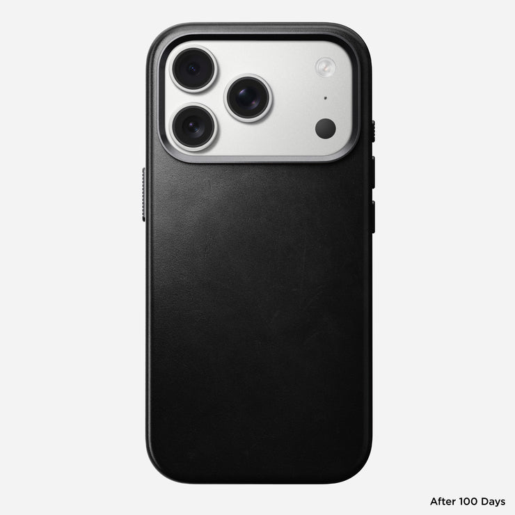 A black iPhone 17 Pro with a triple camera is shown from the back, featuring the Nomad Traditional Leather Case in Black (Horween), MagSafe compatible, against a white background. "After 100 Days" appears in small text at the bottom right.