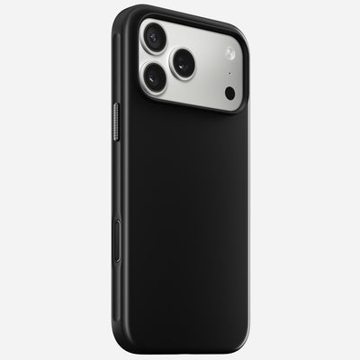 The Nomad Modern Case for iPhone 17 Pro Max in Vulcan Black features a matte finish, a silver triple-lens camera module with flash in the top corner, and a TPU bumper for enhanced grip and style.