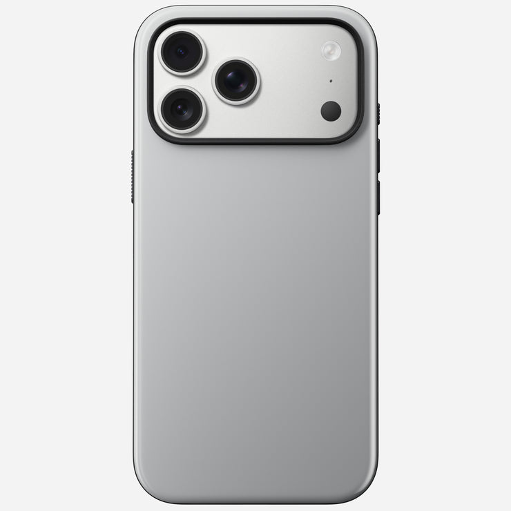 The Nomad Modern Case for iPhone 17 Pro Max in Lunar Gray is shown from the back, highlighting its matte silver finish, triple-lens camera module with flash and sensor in the top left corner, and MagSafe compatibility.