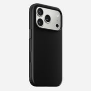 The Nomad Modern Case in Vulcan Black for iPhone 17 Pro features a TPU bumper and cutouts for a triple-lens camera and flash, displayed on the phone against a plain white background.
