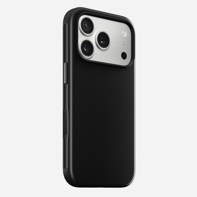 The Nomad Modern Case in Vulcan Black for iPhone 17 Pro features a TPU bumper and cutouts for a triple-lens camera and flash, displayed on the phone against a plain white background.