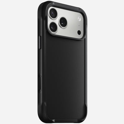 The Nomad Rugged Case in black for iPhone 17 Pro Max features a matte finish and durable TPU bumpers, covering the back and edges while providing access to ports and buttons. Designed for phones with three rear cameras and a top-left flash.