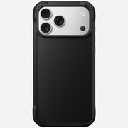 The Nomad Rugged Case for iPhone 17 Pro Max in black features TPU bumpers and a sliding cover that partially reveals the phone’s triple rear cameras and flash, shown against a plain white background.