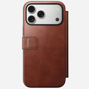 The Nomad Modern Leather Folio for iPhone 17 Pro Max in Olde Dublin Horween leather is shown closed, with its magnetic clasp cover exposing only the phone’s rear camera lenses.