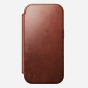 The Nomad Modern Leather Folio for iPhone 17 Pro in Olde Dublin is a closed brown Horween leather case with visible edge stitching, shown vertically on a white background.