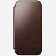 The Nomad Modern Leather Folio for iPhone 17 Pro Max in Rustic Brown, crafted from Horween leather with rounded corners and visible edge stitching, is shown closed against a light gray background.