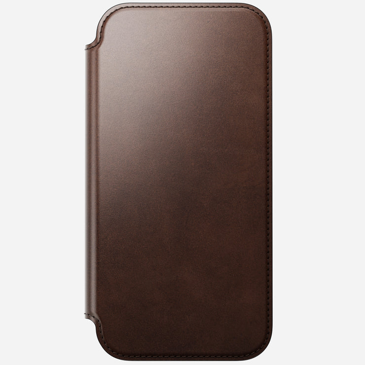 The Nomad Modern Leather Folio for iPhone 17 Pro Max in Rustic Brown, crafted from Horween leather with rounded corners and visible edge stitching, is shown closed against a light gray background.