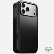 The Nomad Modern Leather Folio for iPhone 17 Pro Max in black Horween leather, featuring MagSafe compatibility and the Horween logo at the bottom right, is displayed on a light background with precise camera cutouts.