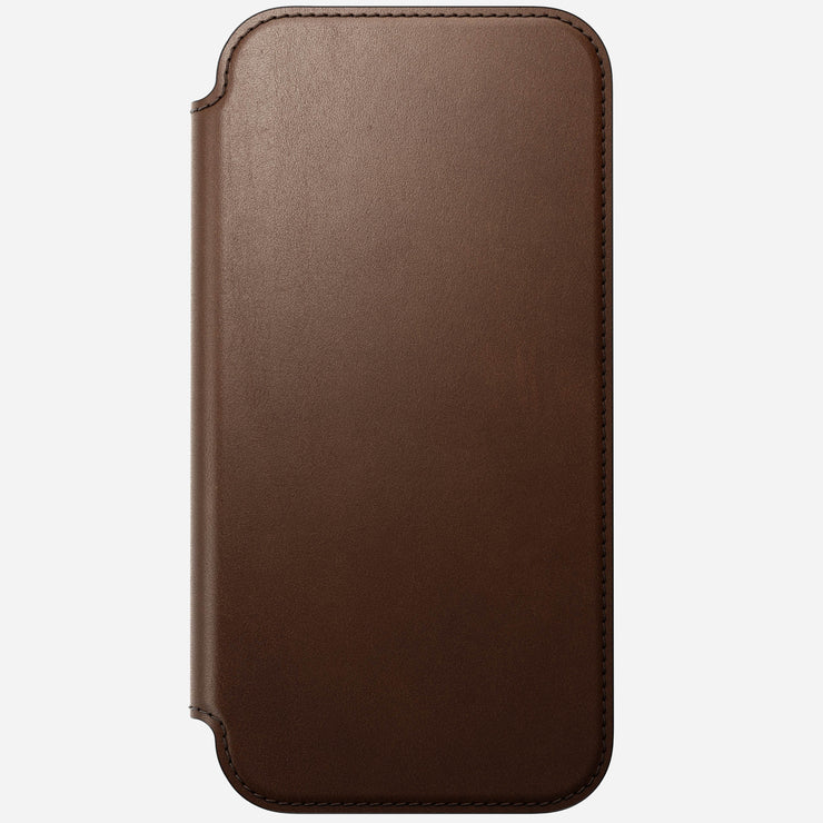 The Nomad Modern Leather Folio for iPhone 17 Pro Max in brown features full-grain leather with rounded edges and visible stitching, shown closed against a plain white background.