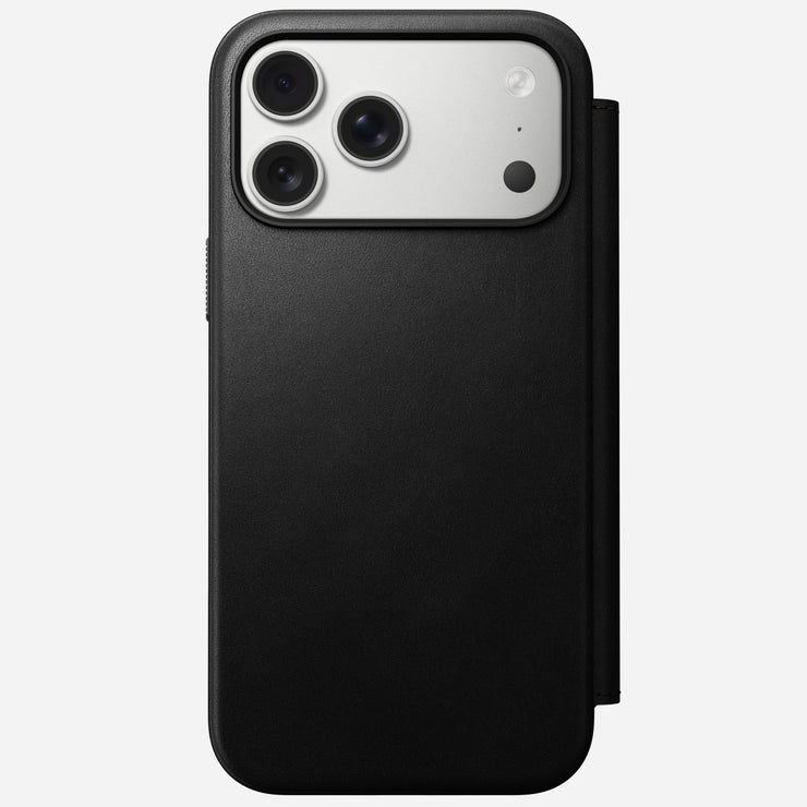 The Nomad Modern Leather Folio for iPhone 17 Pro Max in black is a MagSafe compatible leather flip case, shown from the back with three rear cameras against a light gray background.