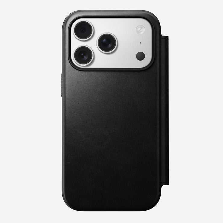 A Nomad Modern Leather Folio for iPhone 17 Pro in black Horween leather, shown from the back with a right-side cover; the phone has three camera lenses and a flash in the top left corner.
