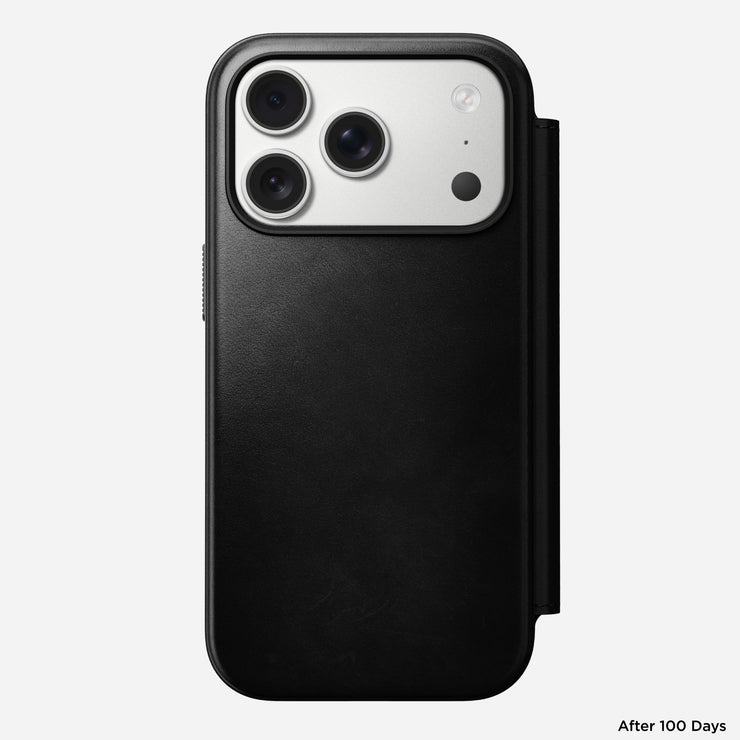 A Nomad Modern Leather Folio - iPhone 17 Pro in black Horween leather is shown from the back, highlighting its triple camera setup. "After 100 Days" appears in small text at the bottom right.