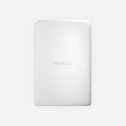 Minimalist image of the Nomad AC Adapter - 100W | Slim | White, a sleek rectangular device with rounded corners and the brand name faintly visible at the center, set against a plain light gray background.