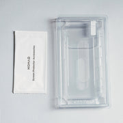 A Nomad Screen Protector - iPhone 17 Pro and its labeled accessories packet rest on a light gray surface; the protector is clear and scratch-resistant.