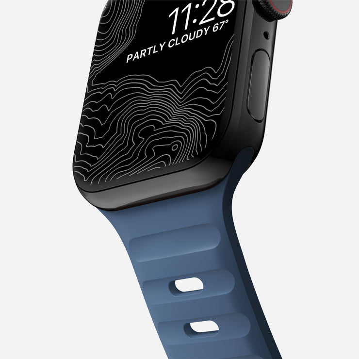 Close-up of the Naval Blue Sport Band, showcasing the custom aluminum closure pin and breathable design features