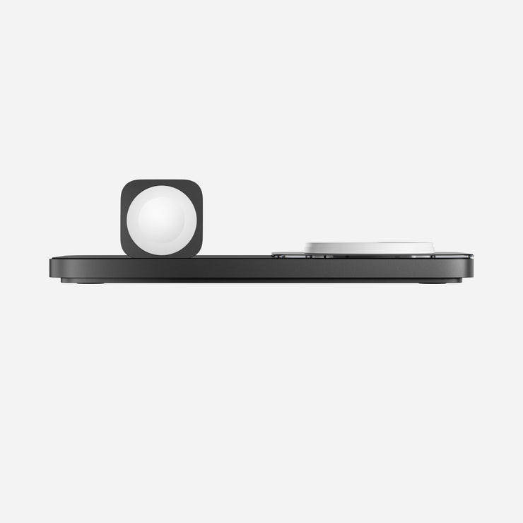 Side view of the Base One Max 3-in-1 charger in Carbide, illustrating its compact and sturdy design with integrated charging areas