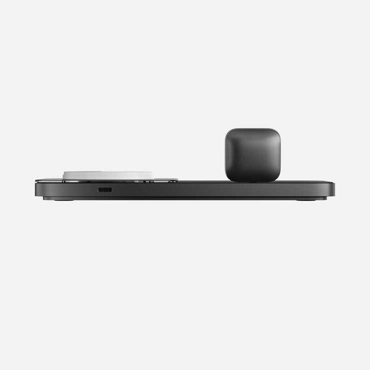 Side view of the 1st Gen Base One Max MagSafe charger, showcasing the smooth metal finish and premium glass top