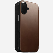 Angled front view of Modern Leather Folio for iPhone 16 Plus in Brown by Nomad Leather. Shows full-grain leather with card slots, cash slot, and removable magnetic clasp. Provides 8ft drop protection and is compatible with MagSafe & wireless charging